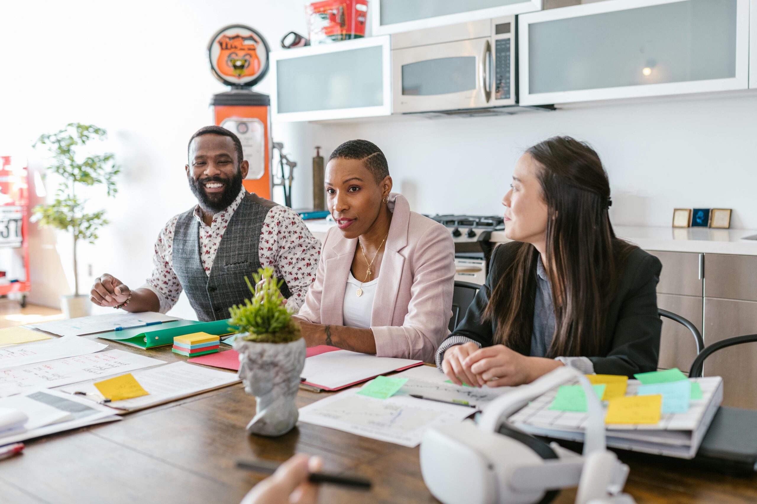 A diverse group of professionals brainstorming and collaborating in a modern office setting.