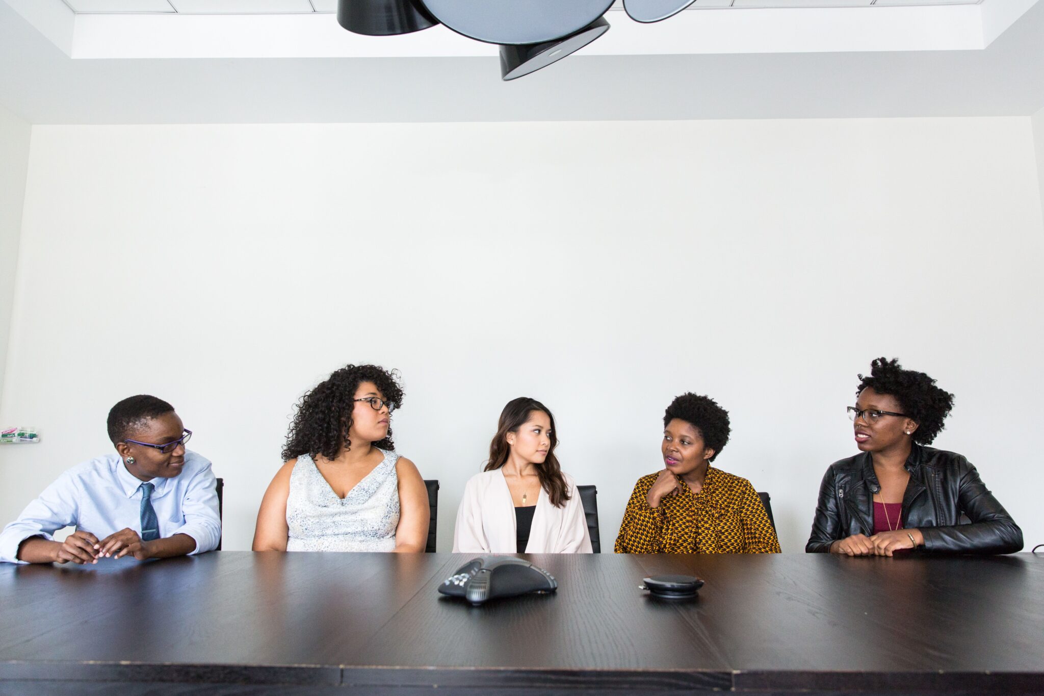 Home A diverse group of professionals having a meeting in a modern office setting. Teamwork and collaboration.