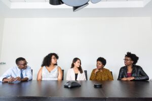 Home A diverse group of professionals having a meeting in a modern office setting. Teamwork and collaboration.
